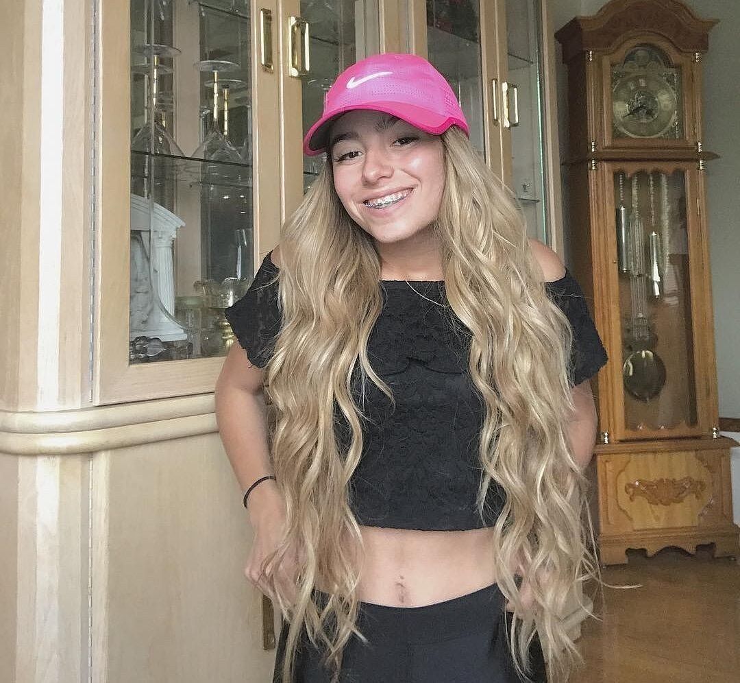 Customer wearing honey brown & ash blonde #12/24 hair extensions