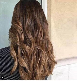 Customer wearing ombre balayage hair extensions