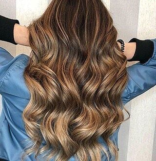 Customer wearing ombre balayage hair extensions